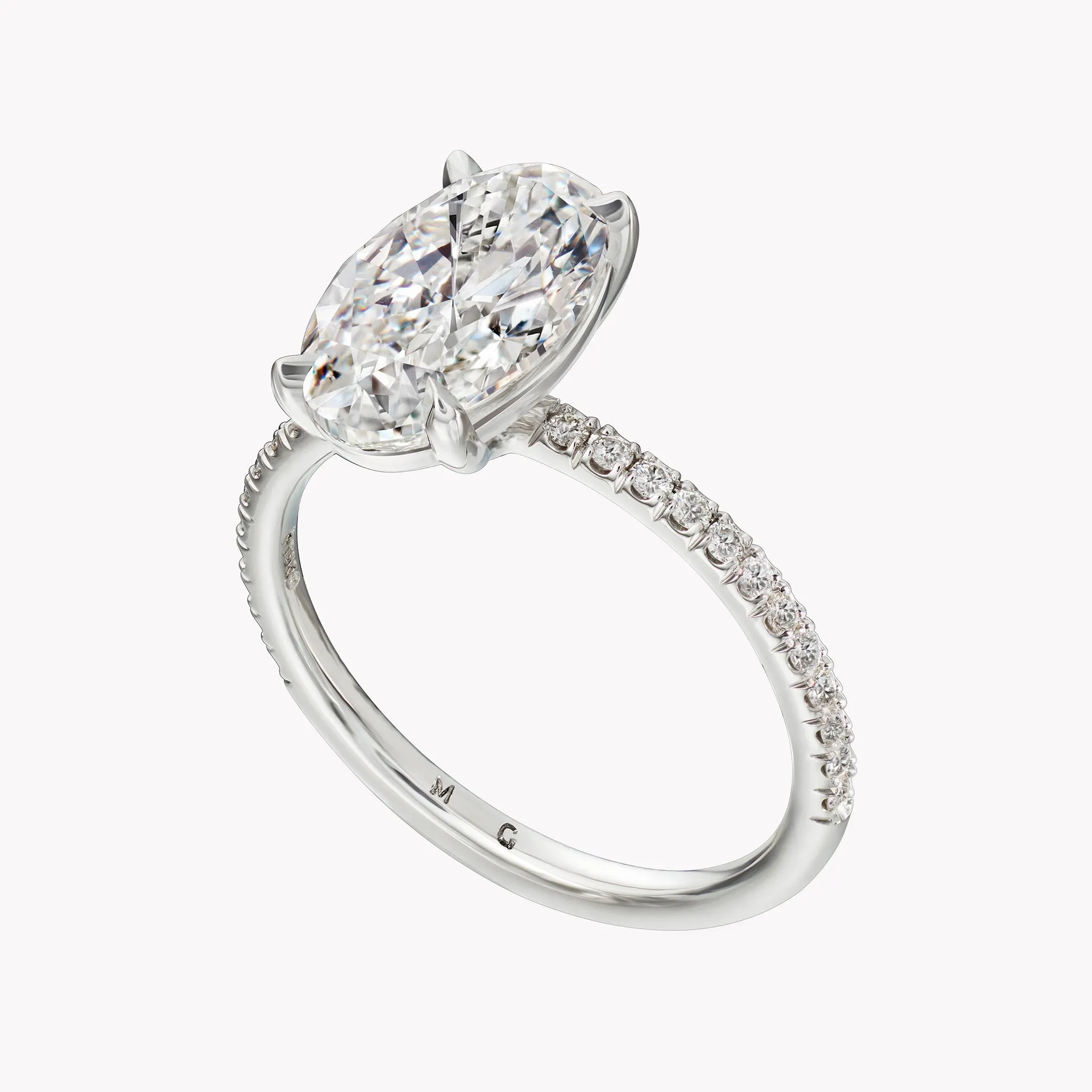 Oval Cut Solitaire Engagement Ring with Diamond Pavé